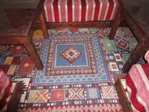 a room with a floor with colorful tiles on it at Dar Yanis in Rabat