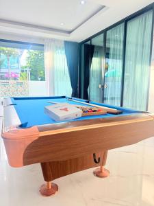 a pool table sitting in a living room with at The Ocean Pool Villa HuaHin in Hua Hin