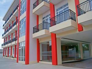 a row of balconies on a building at Karlita Hotel Tegal in Tegal