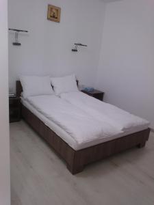 Letto o letti in una camera di Complex Turistic Dávid