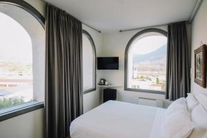 Ένα ή περισσότερα κρεβάτια σε δωμάτιο στο La Ripa Boutique Hotel +63 φωτογραφίες