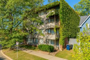 an apartment building with ivy on the side of it at Game Day Ready Steps to Big House, U-M Campus & UM Hospital in Ann Arbor