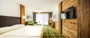 Letto o letti in una camera di Hotel Alphof Alpbach