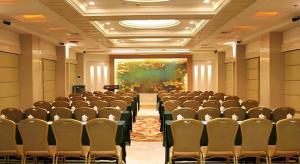 a conference room with chairs and a large painting at Nanchang Galactic Peace International Hotel in Nanchang +265 photos