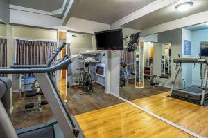a room with a gym with bikes and a tv at Quality Inn Olympia Near State Capital in Olympia