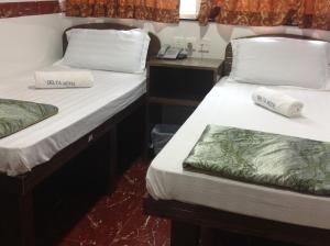 Giường trong phòng chung tại David Lounge
