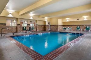 a large swimming pool in a hotel room at Comfort Suites Vicksburg in Vicksburg