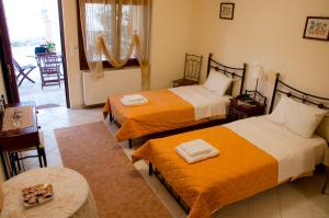 A bed or beds in a room at Nefeli