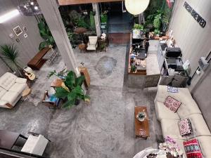 an overhead view of a living room with furniture at B House Chiang Mai Thailand in Chiang Mai