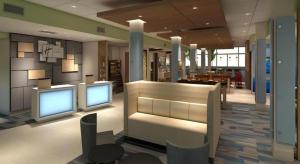 a lobby with two computer monitors in a building at Holiday Inn Express and Suites Hannibal-Medical Center By IHG in Hannibal