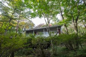 a house in the woods with trees at rinne 2nd living Nasu Forest in Wada
