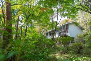 a house in the woods with trees at rinne 2nd living Nasu Forest in Wada +12 photos
