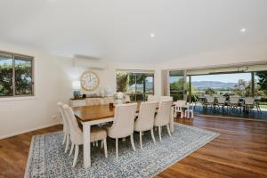 a dining room with a table and chairs at Allambie - Poolside Elegance in Mudgee Countryside in Mudgee