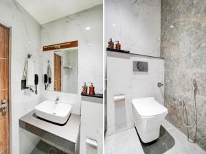 a white bathroom with a sink and a toilet at Hotel O Chandrika Devi Crossway Lucknow in Bhauli