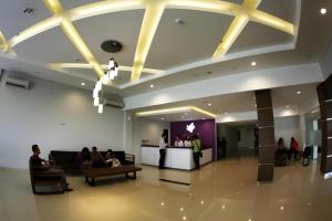 a group of people sitting in a lobby at Amantis Hotel in Demak