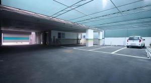a white van parked in a parking lot at Huen Hotel Gimhae in Mugye