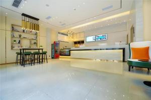 a lobby with a bar and chairs in a store at City Comfort Inn Chongqing Jiangbei Airport T3 Terminal in Chongqing