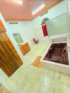 a bathroom with a sink in a room at Janiszel Heaven- A Zion Legacy in Putuppalli