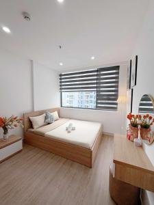 a bedroom with a large bed and a window at Thương Apartment 2 in Thôn Văn Dương +20 photos