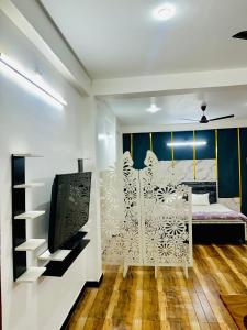 Et tv og/eller underholdning på Ujjain home stay