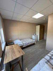 Ένα ή περισσότερα κρεβάτια σε δωμάτιο στο Хостел Ринковий