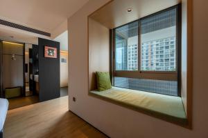 Ένα ή περισσότερα κρεβάτια σε δωμάτιο στο DOTTEL HOTEL