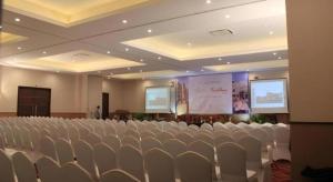 a conference room with chairs and a projection screen at Horison Hotel Sukabumi in Sukabumi +93 photos