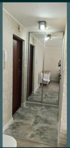 a bathroom with a glass shower in a room at Apartament nad Potokiem in Radom