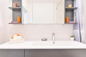 a white bathroom with a sink and a mirror at L'équinox in Bourgheim +56 photos