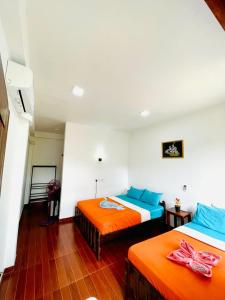 Ένα ή περισσότερα κρεβάτια σε δωμάτιο στο Hotel Ceylan Crest Ella