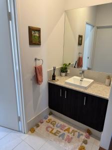 a bathroom with a sink and a mirror at Toodyay Upon Avon Guest House and Gallery in Toodyay