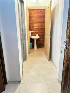 a bathroom with a toilet and a sink at Area Sosta Camper Policoro in Policoro