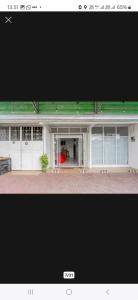 a picture of a building with a green roof at House of A Syariah Sukarame in Tanjungkarang