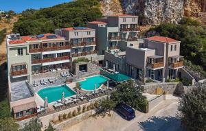 an aerial view of a resort with a swimming pool at Mystery Skiathos Luxury Residence in Skiathos