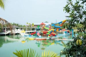 a water park with a colorful water slide at Lamphurai Riverside in Ban Dong Klang