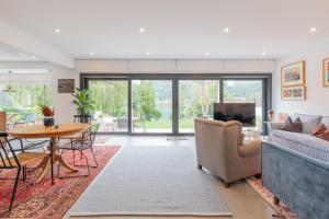 a living room with a couch and a table at Errekaondo - baskeyrentals in Plentzia