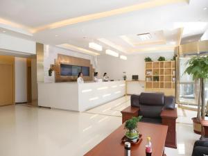 a lobby with a reception desk in a building at GreenTree Inn Langfang Xianghe County Robot Venture Port in Xianghe