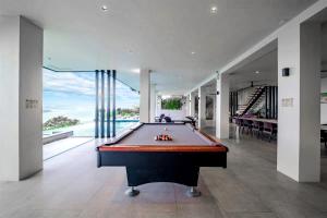 a pool table in the middle of a room at Cliff House Nasugbu in Dayap