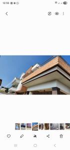 a picture of a house with a roof at Holiday home in posh area of Dehradun in Dehradun