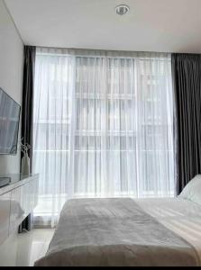 Ένα ή περισσότερα κρεβάτια σε δωμάτιο στο One Bed Room Aprtemen Alam Sutera +22 φωτογραφίες