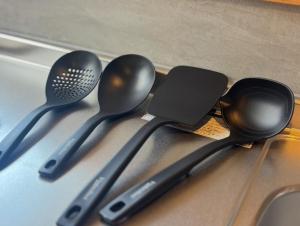 a group of spoons and spatulas on a table at P-Stay宮島中西町 in Hatsukaichi