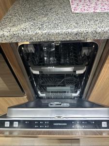 Η κουζίνα ή μικρή κουζίνα στο NestOne - Apartment hotels