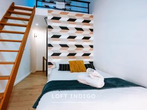 Postel nebo postele na pokoji v ubytování Les Lofts Stéphanois - Au cœur de Sainte-Etienne