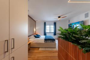 Postel nebo postele na pokoji v ubytování Pyrénées Signature - Suites & Spa + 52 fotografií