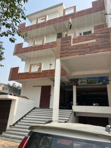 a building with a car parked in front of it at Hotel KT palace in Mirza Murād