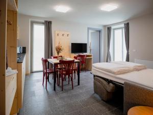 a bedroom with a bed and a table and chairs at Il nido di Siro in Cercino
