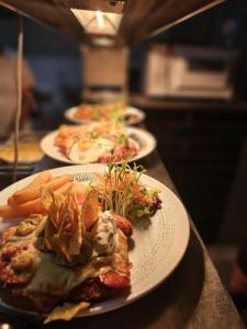 a row of plates of food on a table at Riverside Hotel in Cobram +6 photos