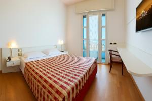 Postel nebo postele na pokoji v ubytování Ruhl Beach Hotel & Suites + 45 fotografií