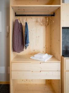 a built in closet in a kitchen with a wooden shelf at Il nido di Siro in Cercino +121 photos