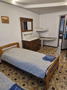 a bedroom with a bed and a sink in it at Apartament Erfolg 6 in Daugavpils +35 photos
